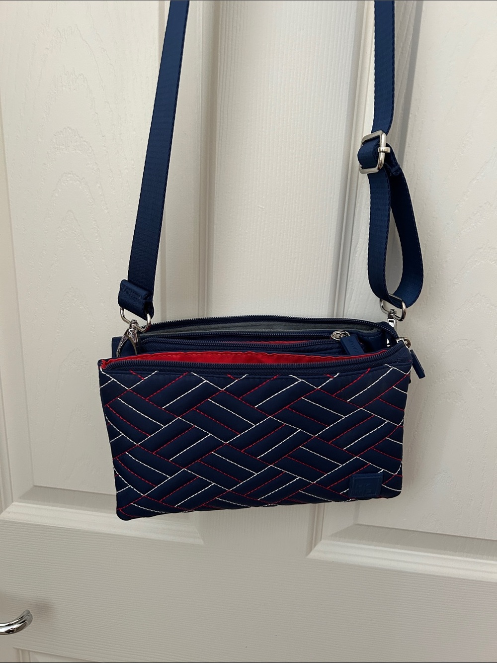 Navy Quilted Crossbody Bag with Red Accents